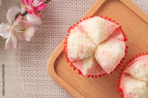 Cute Chinese steamed sponge cake - Fa Gao on wooden table background for spring festival celebration food. photo