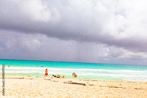 Fototapeta Naklejka Na Ścianę i Meble -  Cancun Mexico beautiful caribbean sea on a sunny day and cloudy sky. Sandy beach