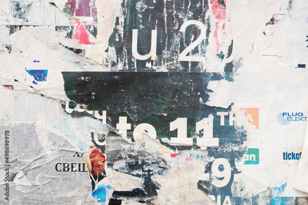 Fototapeta premium Ripped street posters collage on a retro wall background