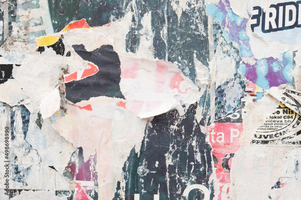 Fototapeta premium Ripped street posters collage on a retro wall background 