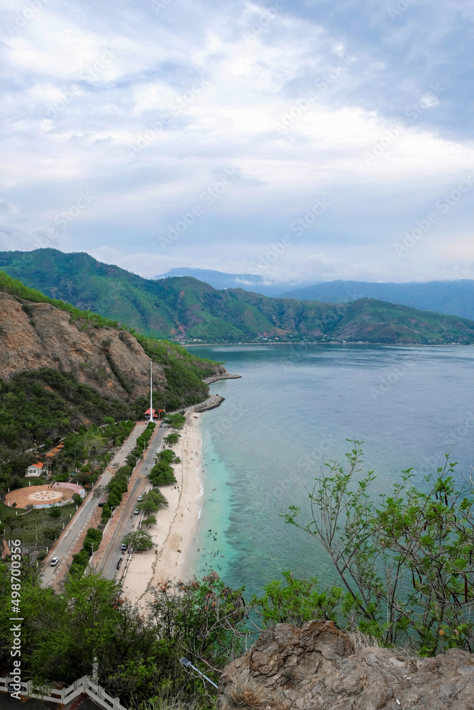 Tropical exotic paradise view of Cristo Rei Beach in Dili, Timor Leste.