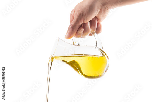 Pouring cooking oil isolated on white background