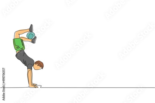 One continuous line drawing of young man soccer freestyler practice keep the ball with feet while handstand in the street. Football freestyle sport concept. Single line draw design vector illustration