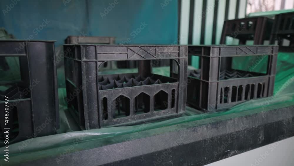 Old plastic boxes for bottles. The past of Soviet trade. Abandoned warehouse. Container from the USSR. Smoth camera movement.