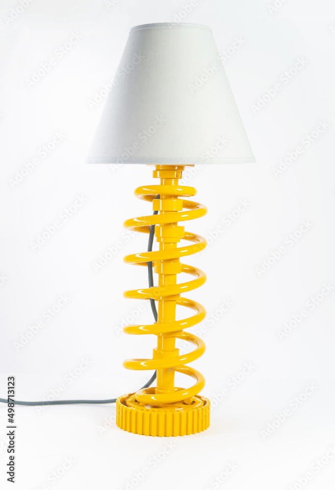Modern table lamp with small lampshade isolated from car parts