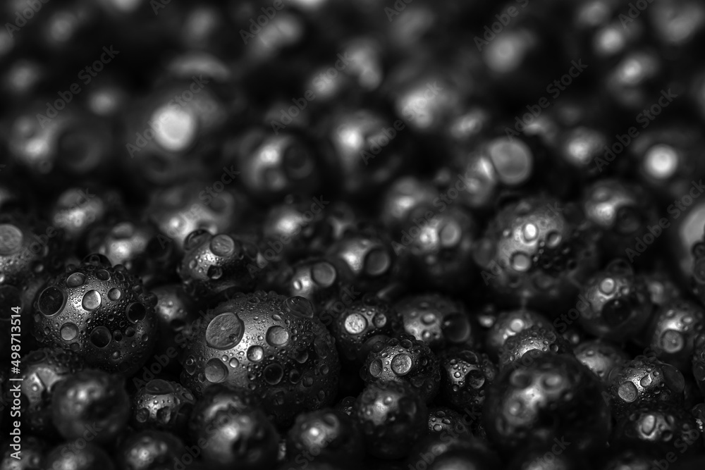 Beautiful background with mother-of-pearl black pearls, top view. Abstract texture for festive backgrounds. Shiny surface of male background. Gems close-up. Silver bright background. Beautiful background with mother-of-pearl black pearls, top view. Abstract texture for festive backgrounds. Shiny surface of male background. Gems close-up. Silver bright background.