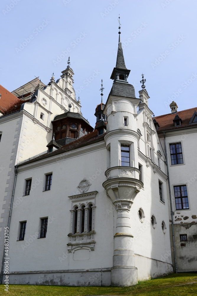 walls of an ancient stone castle with elements of architecture