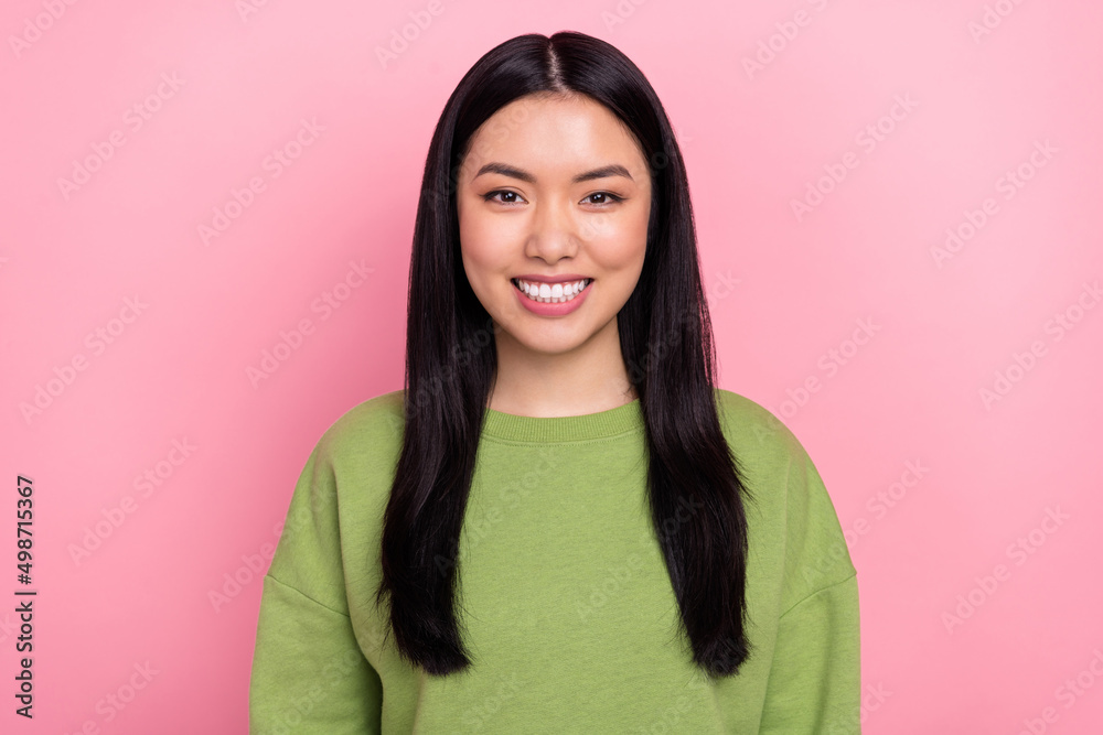 Photo of cute brunette young lady wear green sweater isolated on pink color background