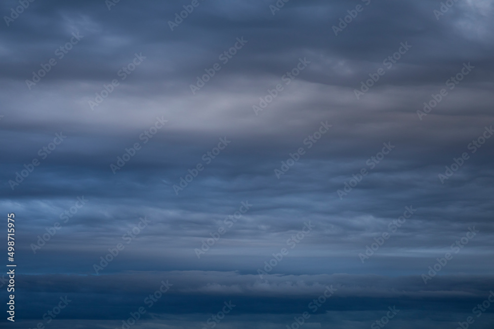 Natural background of dramatic dark stormy colorful clouds