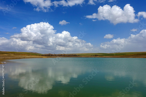 wonderful spring landscape of sky lake and clouds,clouds reflecting in water, © kodbanker