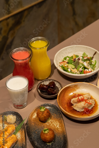 Iftar food menu with juice, dates, and laban