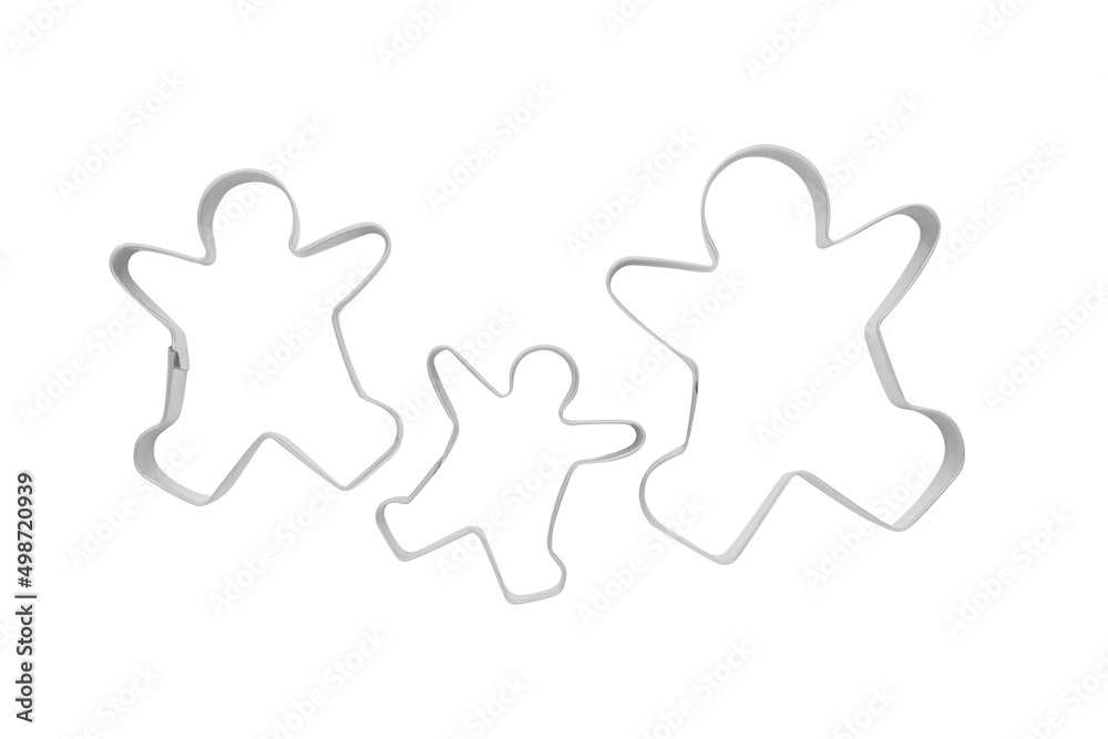 Gingerbread man cookie cutters on white background, top view Gingerbread man cookie cutters on white background, top view