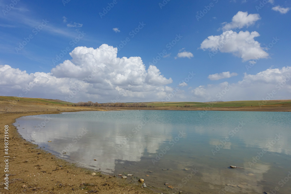 Obraz premium wonderful spring landscape of sky lake and clouds,clouds reflecting in water,