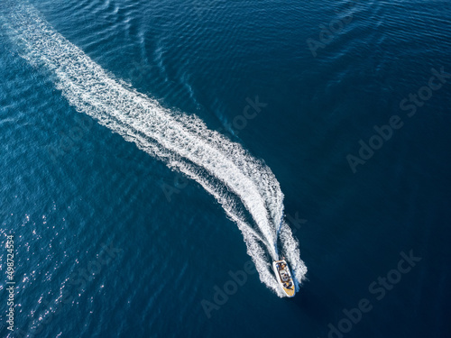 Aerial view of speedboat crossing Bodrum Harbor, Turkey © efired
