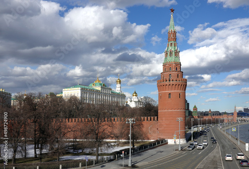 Vodovzvodnaya tower, Ivan the Great Bell Tower and Grand Kremlin Palace of Moscow Kremlin behind the wall on embankment ot the Moscow river on bright spring sunny day photo