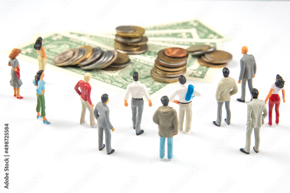 miniature people. businessman stands near dollar money. investments and earnings for work miniature people. businessman stands near dollar money. investments and earnings for work