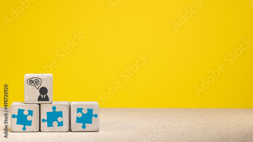 puzzle symbols on concrete cubes. business and strategy concept. copy space