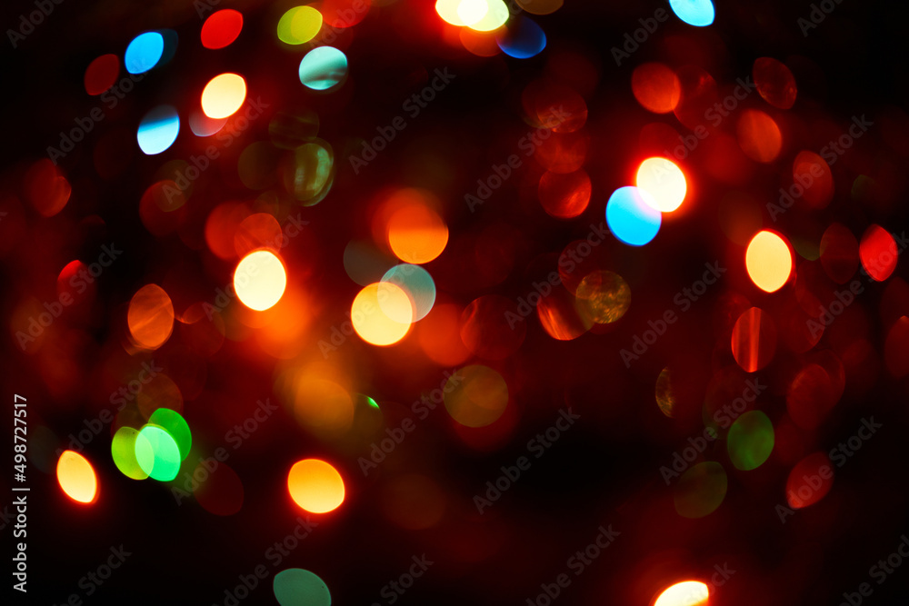 Colorful bokeh abstract background. Glittering stars on dark background. Lights. Garland. Background Colorful bokeh abstract background. Glittering stars on dark background. Lights. Garland. Background