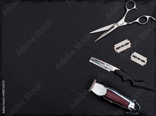 Barber shop tools on Black with place for text.