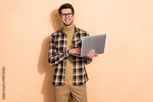 Photo of smart confident expert guy use netbook browsing search workshop isolated pastel color background