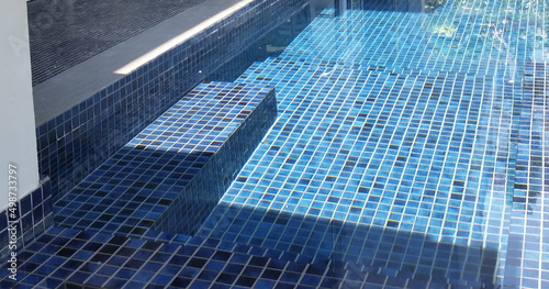 Slika na platnu clear water in the swimming pool is covered with mosaics