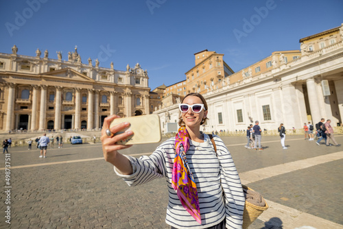 Photography Young woman walks on saint Peter's square in Vatican