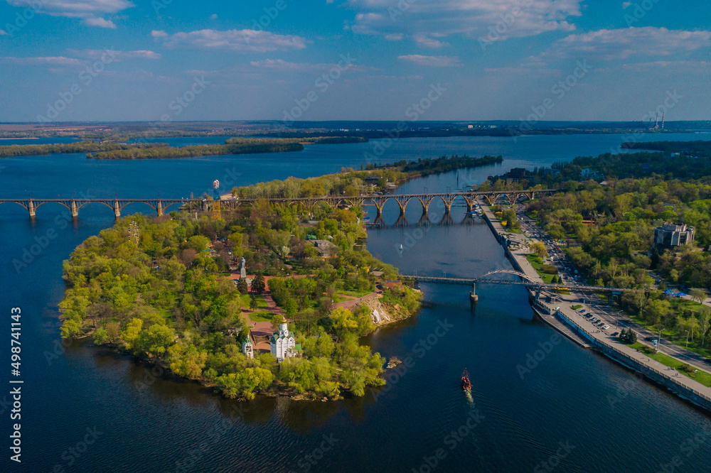 Aerial view of the beach of Monastery Island. Panorama of the city. Dnepr River. City of Dnipro. Ukraine. Leisure and entertainment park named after Taras Shevchenko.