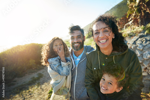 Children are one of the biggest influences of happiness. Cropped shot of a family of four spending the day outdoors.