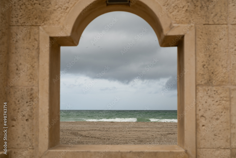 Sea and beach view through a window