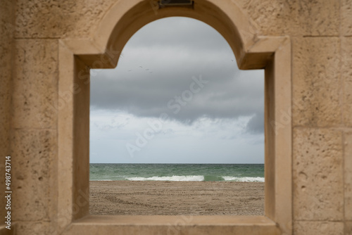 Sea and beach view through a window