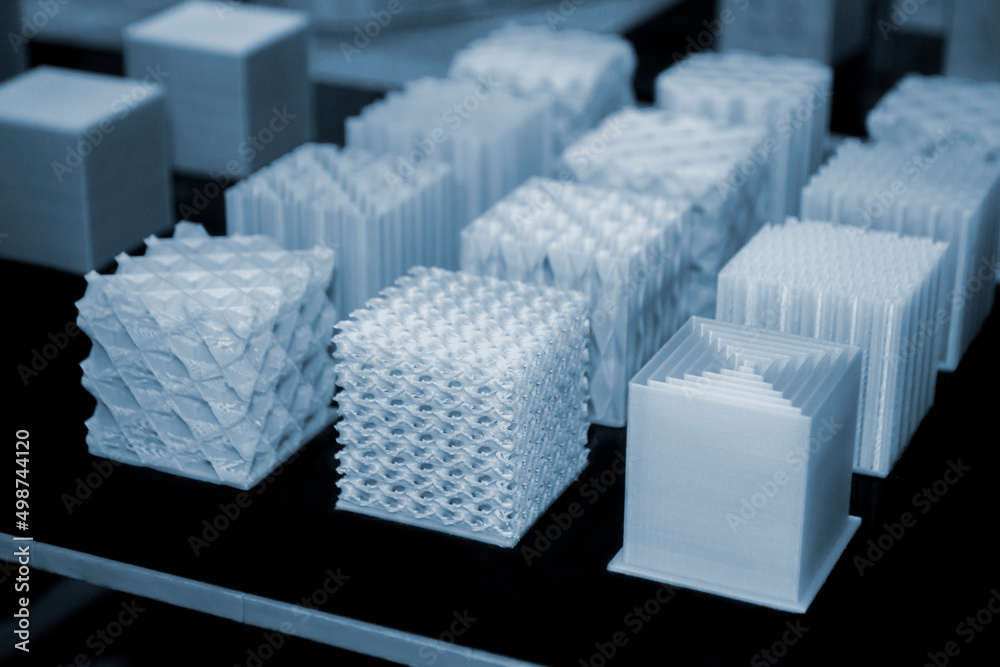 White models prototypes printed on 3D printer from plastic close-up. New  progressive additive modern 3D printing technology. Three-dimensional  object created by high-precision 3D printing technologies Stock Photo |  Adobe Stock