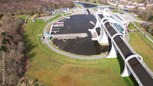 Low level aerial image of the Falkirk Wheel. Unique rotating boat-lift joining the Forth and Clyde canal and the Union Canal in Central Scotland. photo