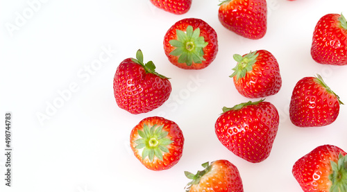 red ripe strawberries on a light background. copy space