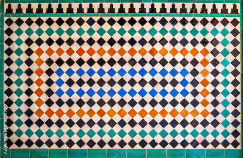 Colorful tiles in a medieval palace in Granada, Spain
