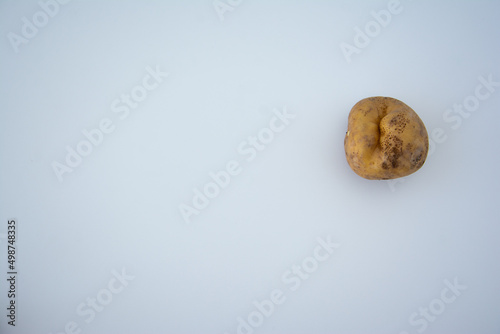 Wallpaper Mural Ugly potato isolated on white. Top view, flat lay Torontodigital.ca
