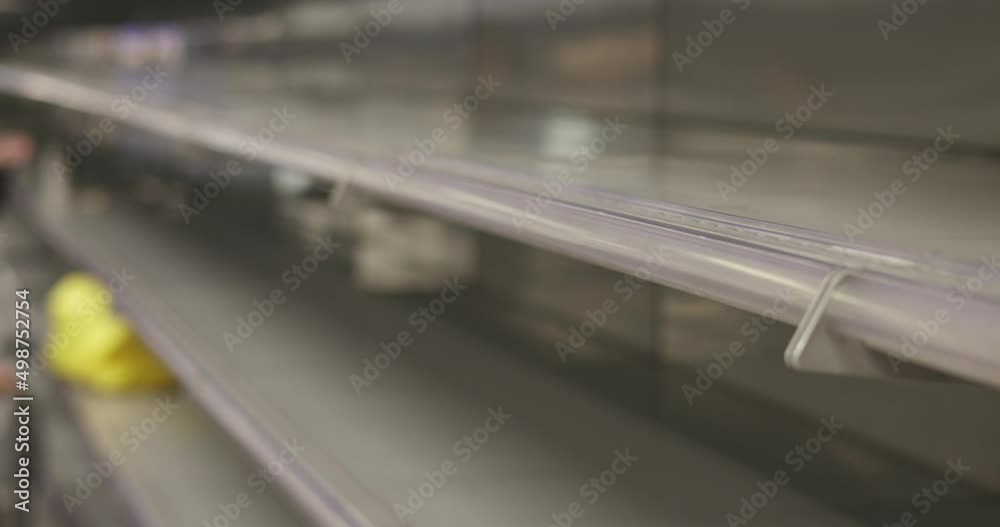 View of empty supermarket shelves, grocery store work stoppage closes, sanctions and embargo, panic buying with supplies and goods shortage, food crisis and deficit concept
