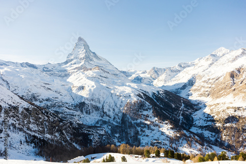 Snowy mountain Matterhorn during the day in winter. Zermatt, swiss alps
