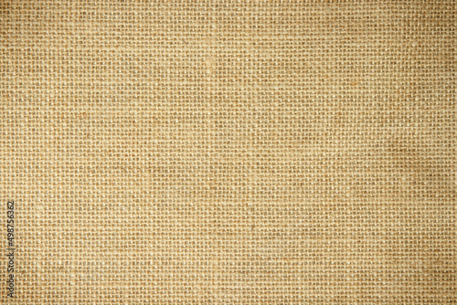 Jute hessian sackcloth burlap canvas woven texture background pattern in light beige cream brown color blank. Natural weaving fiber linen and cotton cloth decoration. 