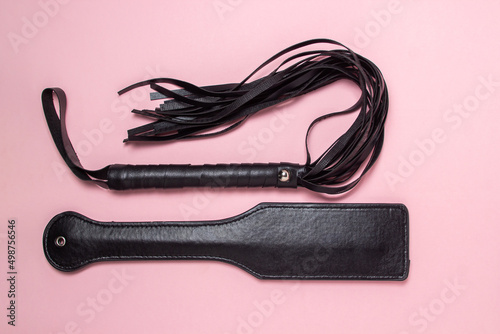 Fotografija BDSM accessories on a pink background