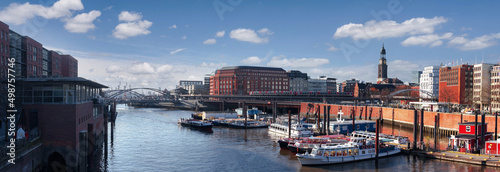 Obraz na płótnie Cityscape of Hamburg, Germany, on the sunny day. Wide panoramic view on the city center, Hafencity, Hauptkirche St. Michaelis with the harbor in the foreground and Hamburg port in the background w salonie