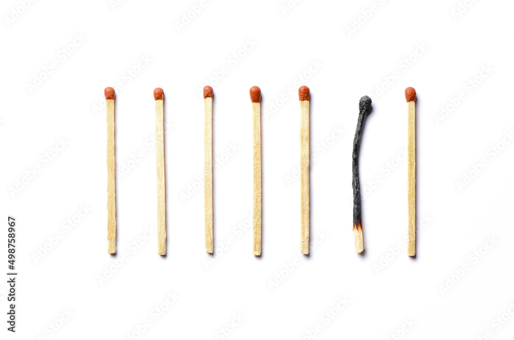 Burnt matches on a white background. The concept of burnout syndrome at work Burnt matches on a white background. The concept of burnout syndrome at work
