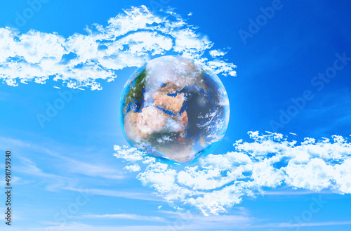 Save Earth and Our Planet  Environmental Ecology and Nature Conservation For Next generations Concept. Cloudy Hands Holding Earth on Blue Clouds Sky Background. Elements of image furnished by NASA