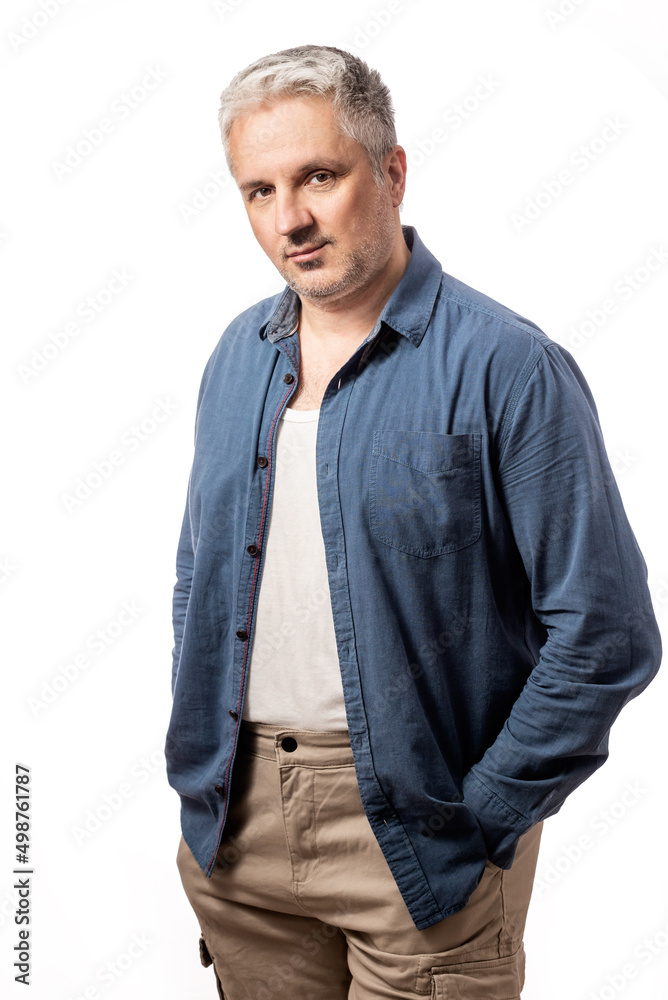 Portrait of a bearded middle-aged man looking thoughtfully at the camera over a white studio background with copy space Portrait of a bearded middle-aged man looking thoughtfully at the camera over a white studio background with copy space