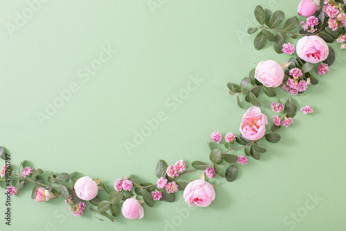 pink flowers and green leaves on green background