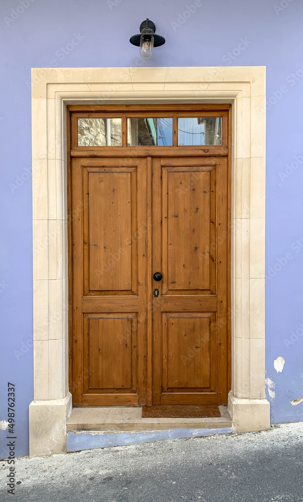 Old brown wooden door with glasses. Details Classic vintage door