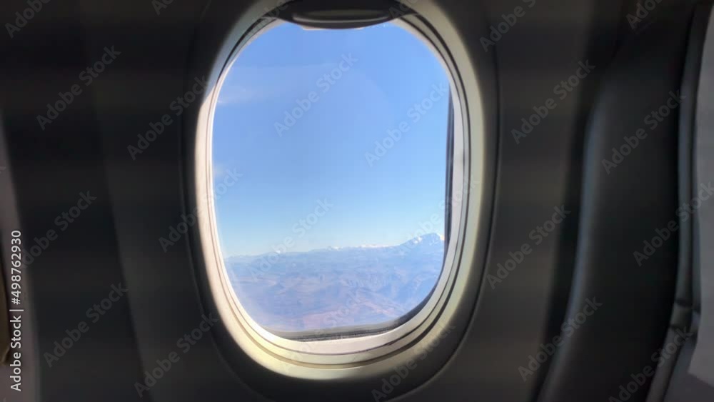 View from an Airplane Window onto the Andes Mountains, South America. 4K Resolution. View from an Airplane Window onto the Andes Mountains, South America. 4K Resolution.