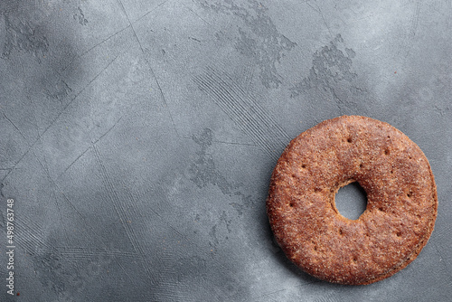 Reikäleipä - traditional finnish rye bread on a gray concrete background photo