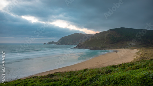 Mar do Fora Beach in Fisterra: Evening HDR View of a Lone Person on the Beach in Finisterre, Galicia, Spain photo