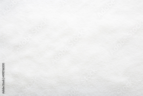 White dry sugar background. Top down view. Empty place for text.