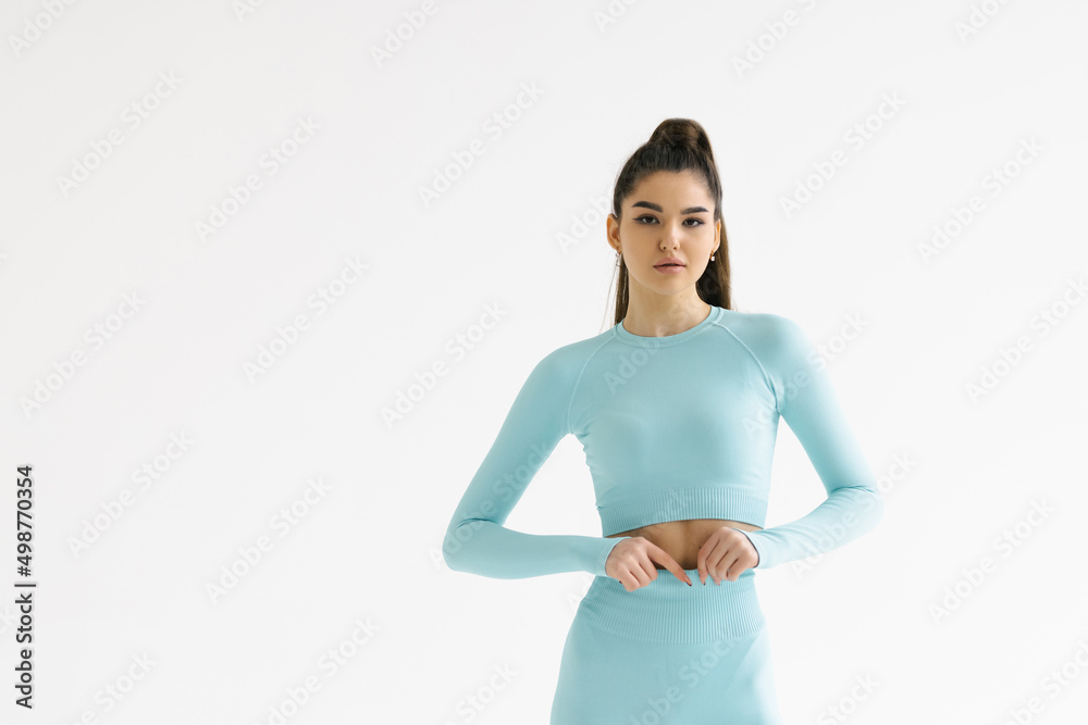 Portrait of beautiful healthy woman sport wear copy space white background. People beauty perfect body slim fit fitness sexy girl happy relax. Freedom lifestyle healthcare concept Portrait of beautiful healthy woman sport wear copy space white background. People beauty perfect body slim fit fitness sexy girl happy relax. Freedom lifestyle healthcare concept
